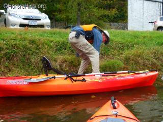 Image: CopyrightHorseHints.org/Getting into launched kayak from Fletcher's Cove canal bank.