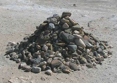 Image:  Creative Commons Attribution-Share Alike 3.0 Unported/ 	D. Gordon E. Robertson/ Pile of rocks started by Nelson Mandela and added to by former prisoners of Robben Island Prison, South Africa
